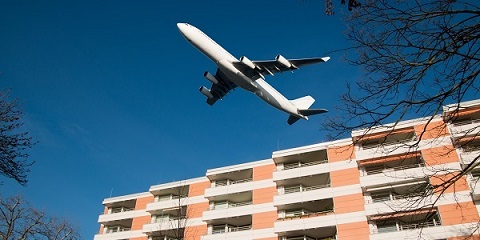 Aircraft noise, airplane over residential house